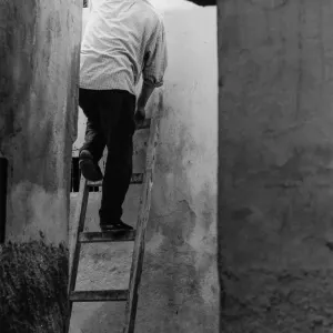 Man standing on ladder