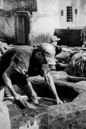 Man working in tanning pit