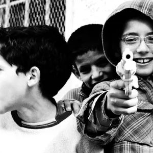 Boy pointing gun
