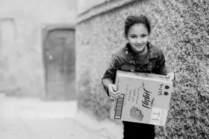 Girl carrying box