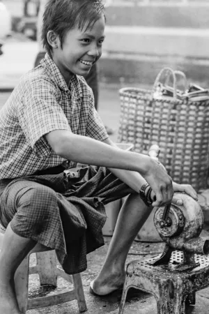Boy working with screw wrench