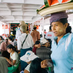 Woman selling watermelons on ferry