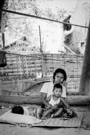 Mother and son sitting under the floor