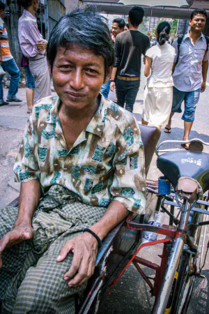 Pedicab driver wearing longyi