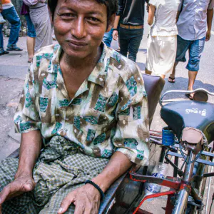 Pedicab driver wearing longyi