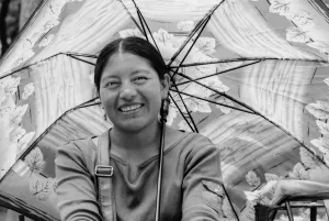 Woman putting sunshade up