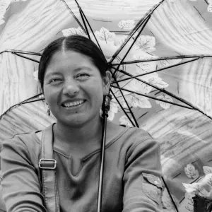 Woman putting sunshade up