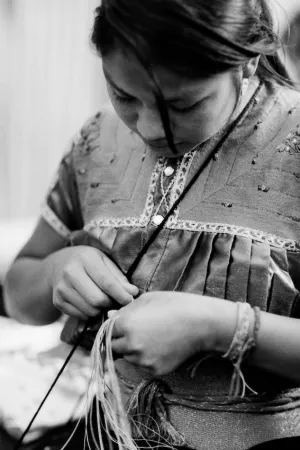 Young woman stitching