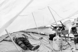 Man taking nap in tent