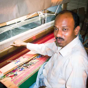 Man weaving Himroo