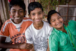 Three boys smiling