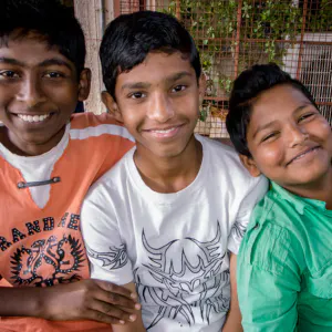 Three boys smiling