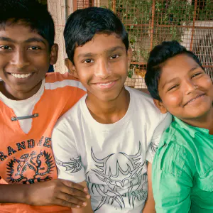 Three boys smiling