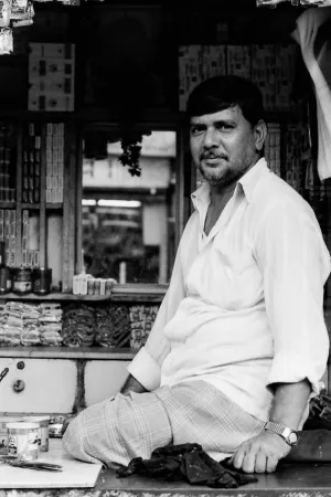 Man sitting in small shop