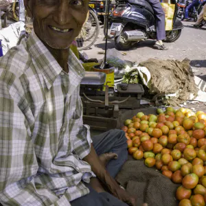 Old man with Tilaka selling tomatoes