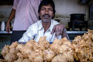 Man selling Pakora in fried food stand