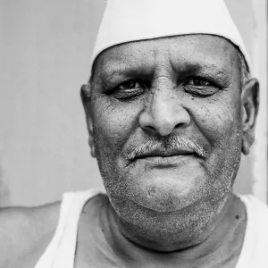 Man wearing Gandhi cap