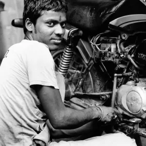 Man repairing a motorbike