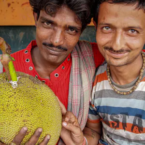 Men holding jackfruit