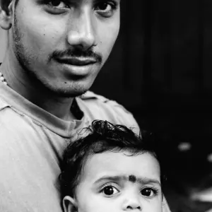 Father and kid with mile-long lashes
