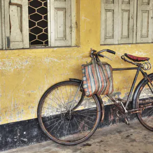 Bicycle leaned against wall