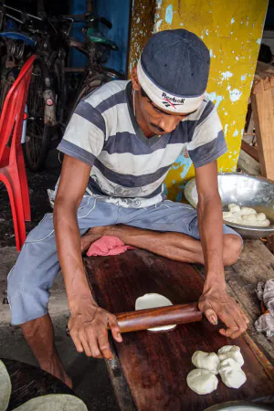 Man working with rolling pin
