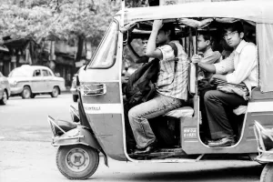 Passengers on auto rickshaw