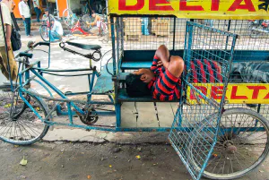 Man napping in cage