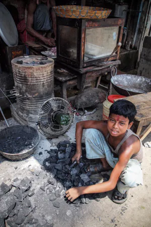 Boy selling coals
