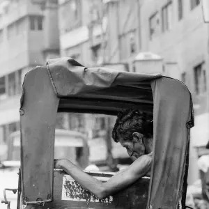 Rickshaw wallah sleeping