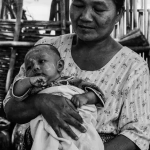 Older woman holding baby