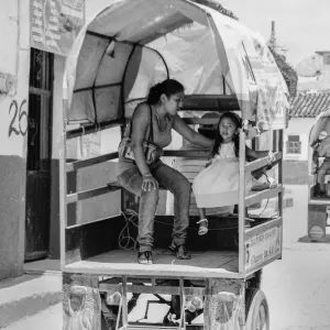 Parent and  child on Motocarro