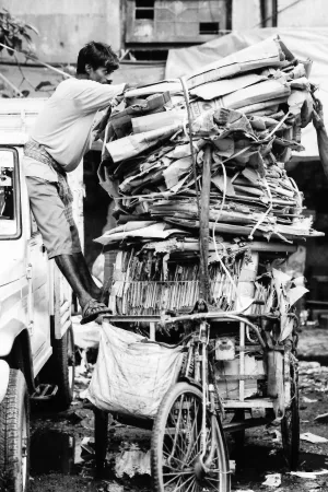 Overloaded tricycle with cardboards