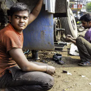 Men repairing truck