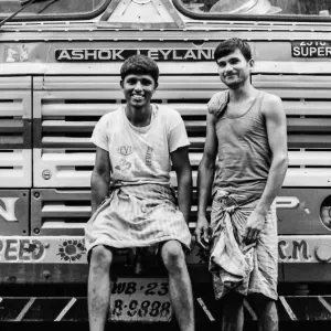 Two men in front of truck