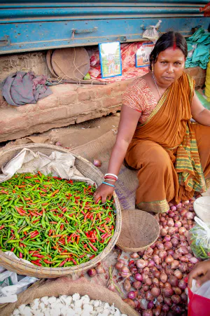 Woman selling chili peppers