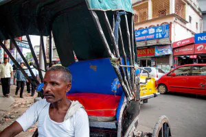 Rickshaw wallah resting