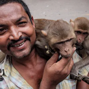 Man walking with monkeys