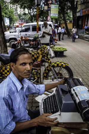 Man working with typewriter