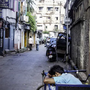 Man sleeping by roadside