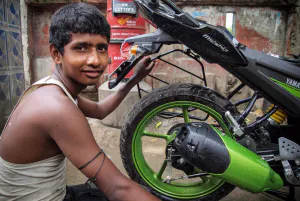 Man repairing motorbike