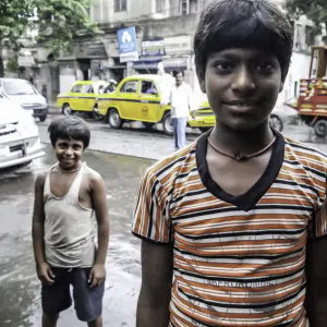 Two boys standing by roadside
