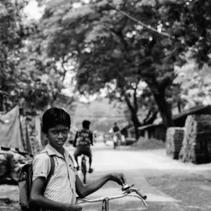 Boy standing by roadside