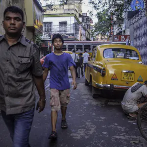 Men walking lane in Kolkata