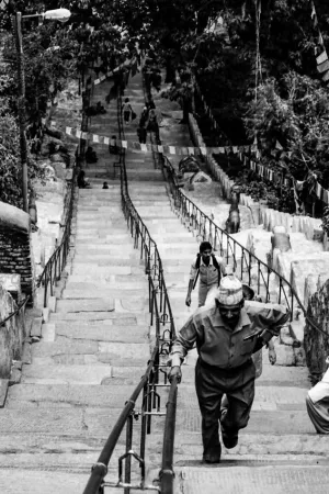 Man climbing steep stairway