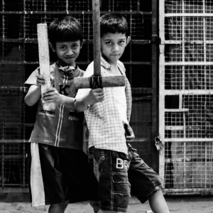 Two boys holding bat