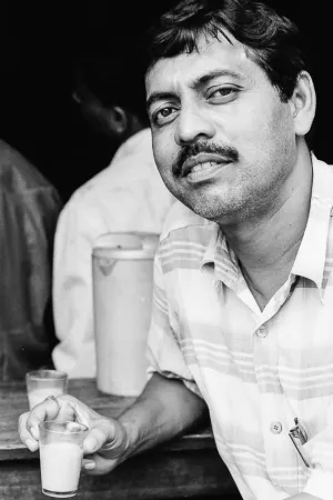 Man drinking a cup of Chai