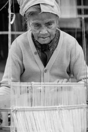 Older woman weaving