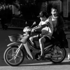 Husband and wife on a motorbike