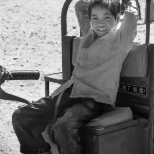 Boy sitting on tractor